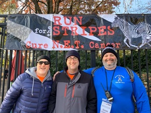 A group of smiling participants at the Run for the Stripes 5K